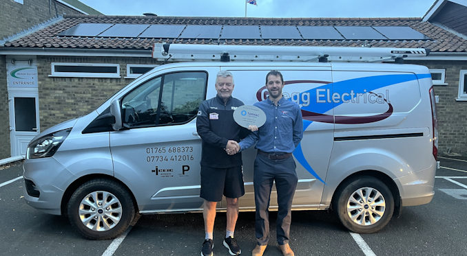 Martyn Coombs (chairman Bedale Sports Club and Community Centre) with Austin Gregg (Gregg Electricals) with the second set of 9 solar panels on the changing room.